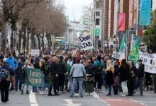 A number of those present carried anti-vaccine placards (Image: Rolling News)