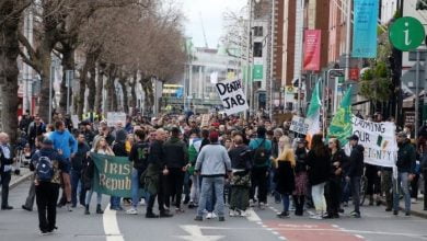 A number of those present carried anti-vaccine placards (Image: Rolling News)